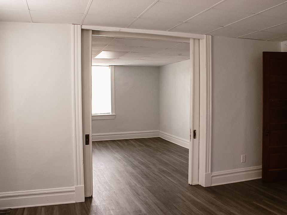 Bedroom, looking through pocket doors into the living room.
