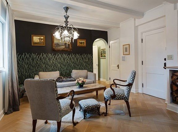 The second seating area of the living room.  Note the wood herringbone patterned floor in contrast t