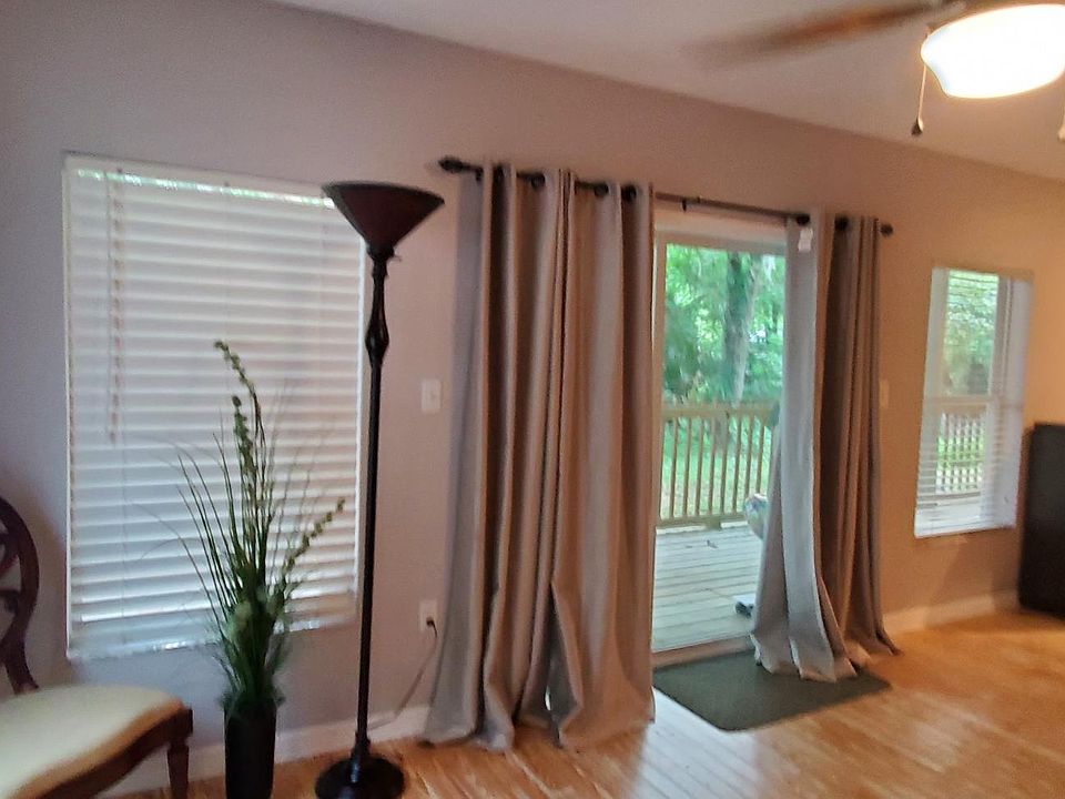 sliding glass door on the opposite side of the main- entry to the property for privacy