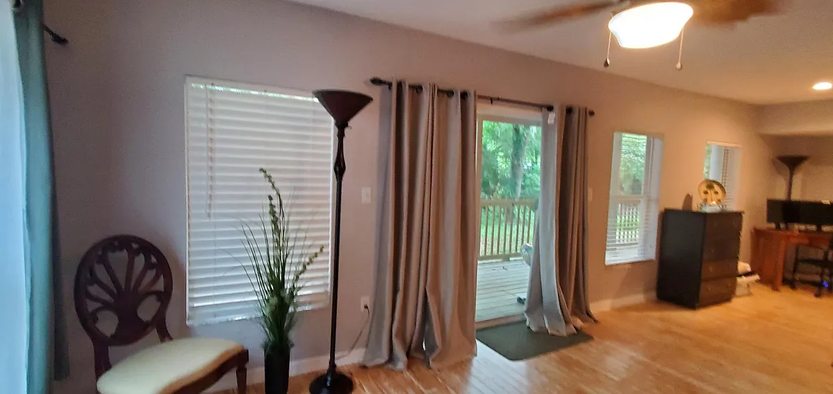 sliding glass door on the opposite side of the main- entry to the property for privacy - 6542 Sherry Ln