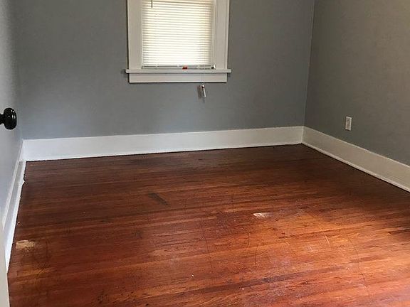 Bedroom natural hardwood floors walk in closet