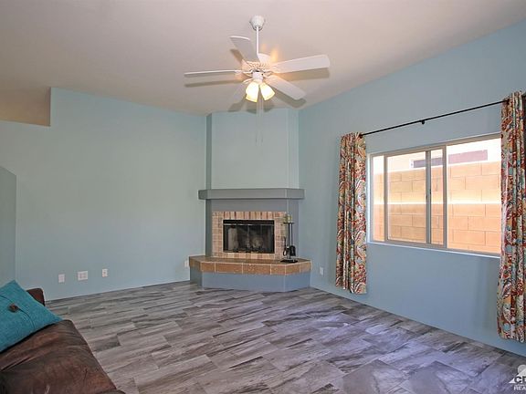 Spacious living room with wood burning fireplace