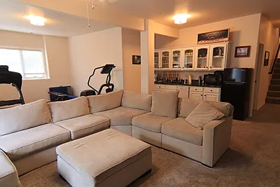 Basement Living Room with sink/ dishwasher and small Fridge/Freezer