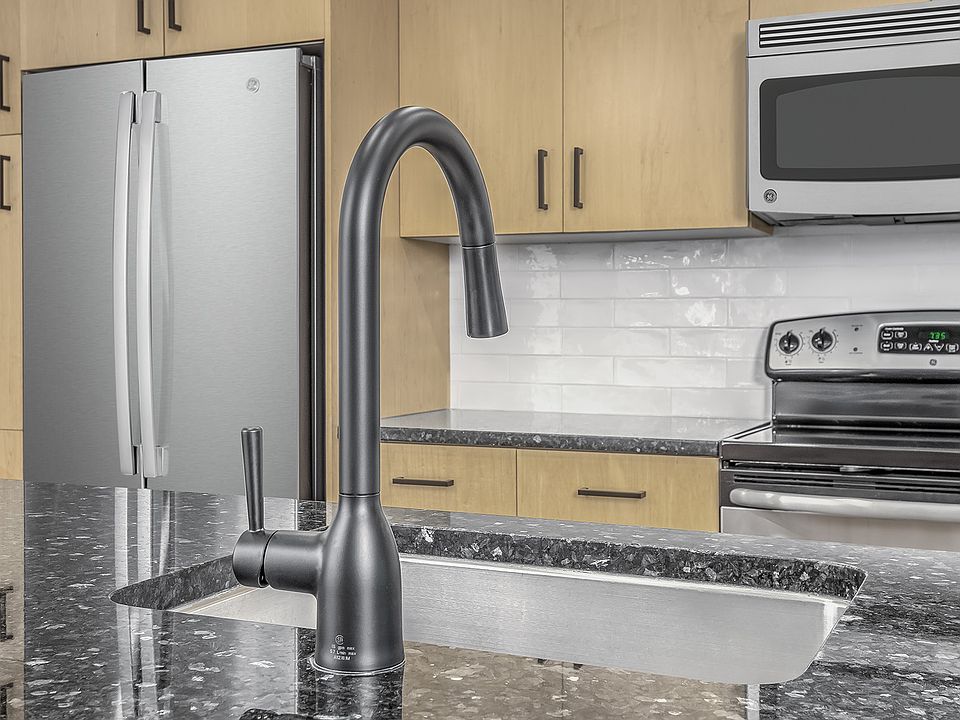 Beautifully renovated kitchens feature modern white subway tile backsplash and sleek matte black fixtures