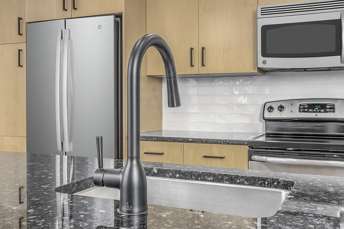 Beautifully renovated kitchens feature modern white subway tile backsplash and sleek matte black fixtures - Zoso Flats