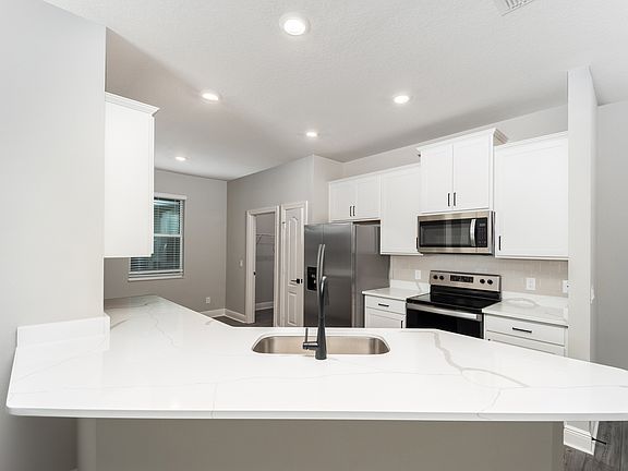 This kitchen includes a full suite of stainless steel appliances!