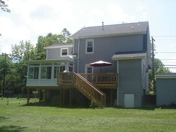 Rear of home, with deck/sunroom addition