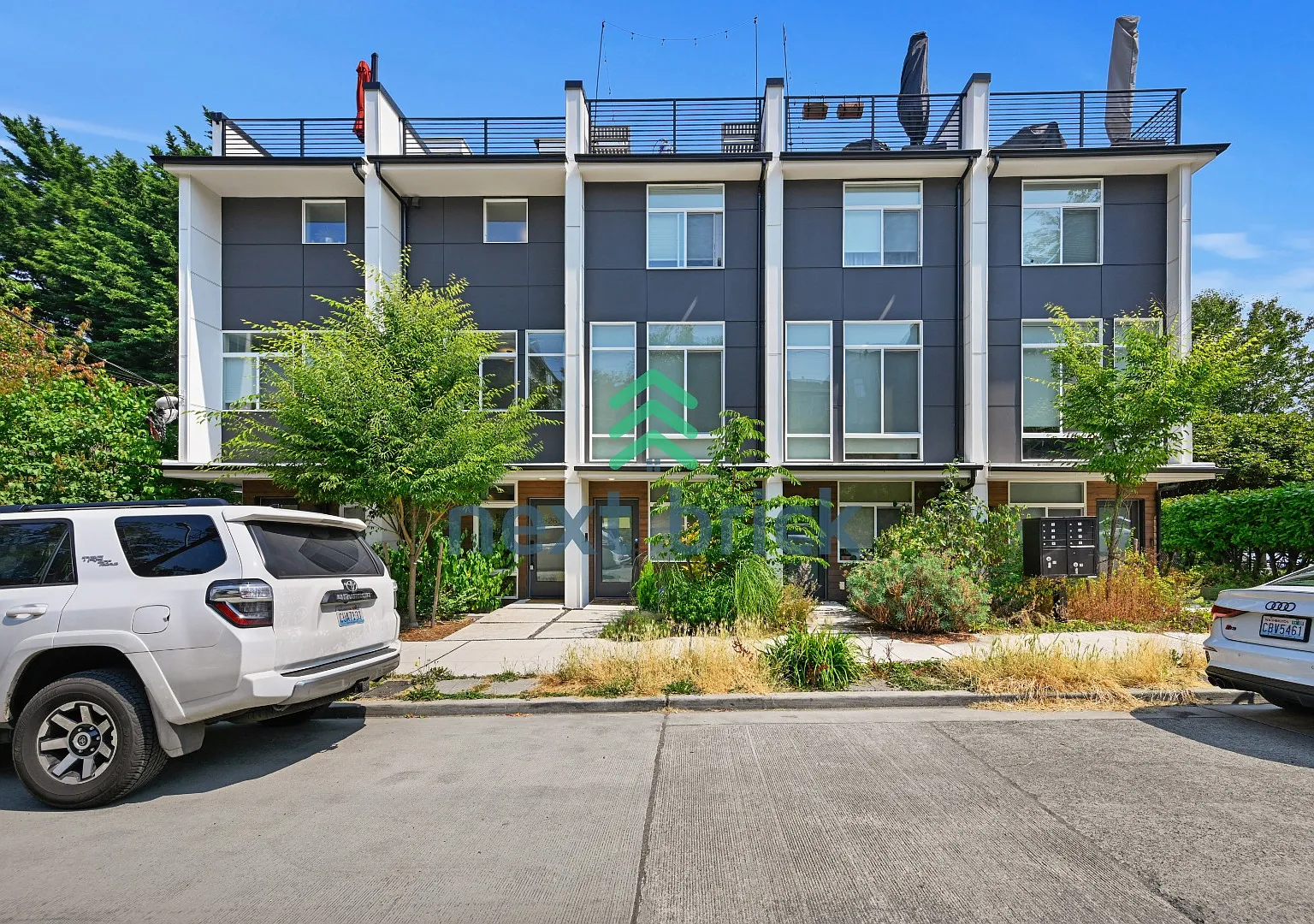 "Charming 3-Bedroom Townhouse Oasis in Heart of Seattle Spacious 1460 Sq Ft with 2 Full Baths!" — Photo 1