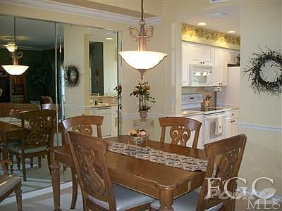 Dining room w/ custom mirror & lighting.