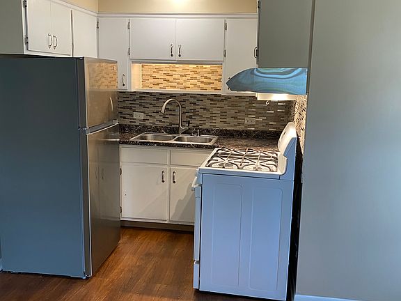 U-shaped kitchen open to living room