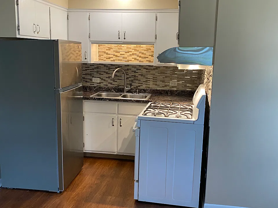 U-shaped kitchen open to living room