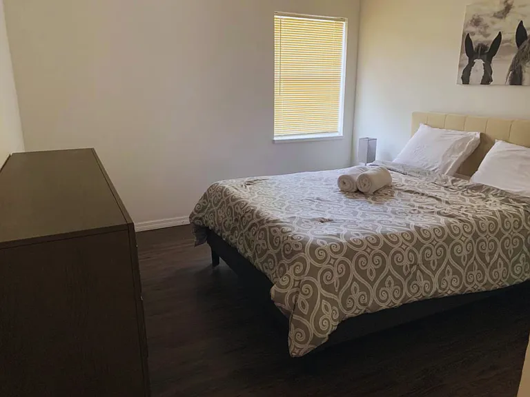 Bright Bedroom with Nightstands, Lamps & Elegant Decor.