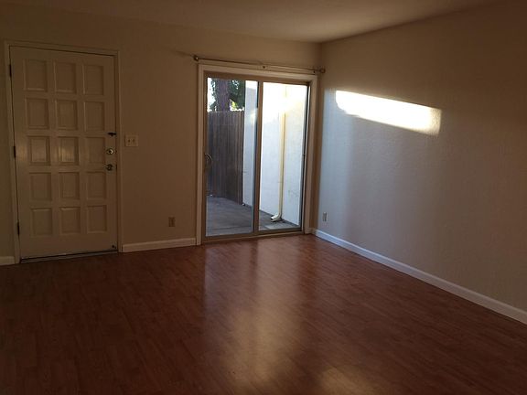 French door in the living room that look out to the fenced front yard
