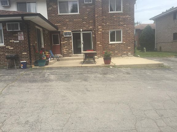 the back of the unit with patio, the building has 4 units.