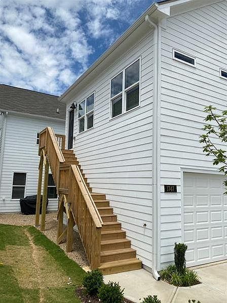 Access the apartment above the garage from the stairs. The unit and garage are detached from the house and do not share any walls with neighbors.