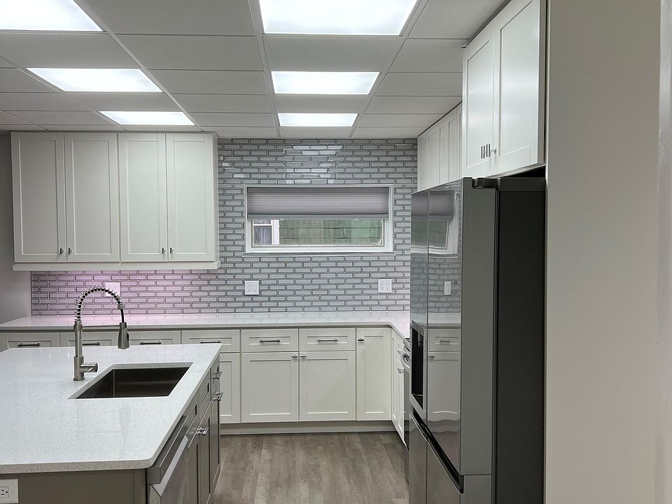 KITCHEN, HIGH END APPLIANCES AND UNDER CABINET LIGHTING.