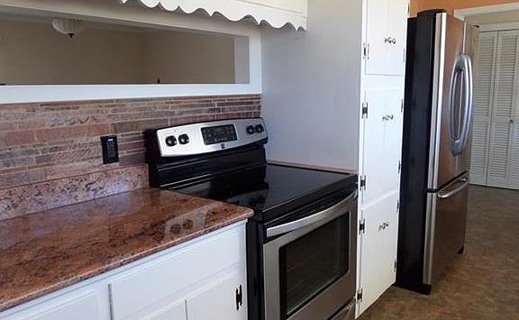 Notice the access window from kitchen to living room.  Provides a view into the back yard also.