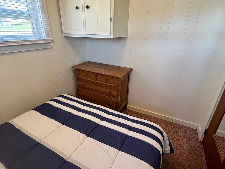 Bedroom 2 hanging cabinet and dresser.