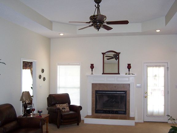 Great Room features gas fireplace and trayed ceiling