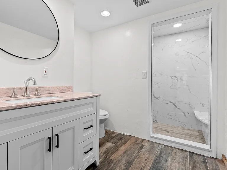 Downstairs bathroom with a river rock Shower