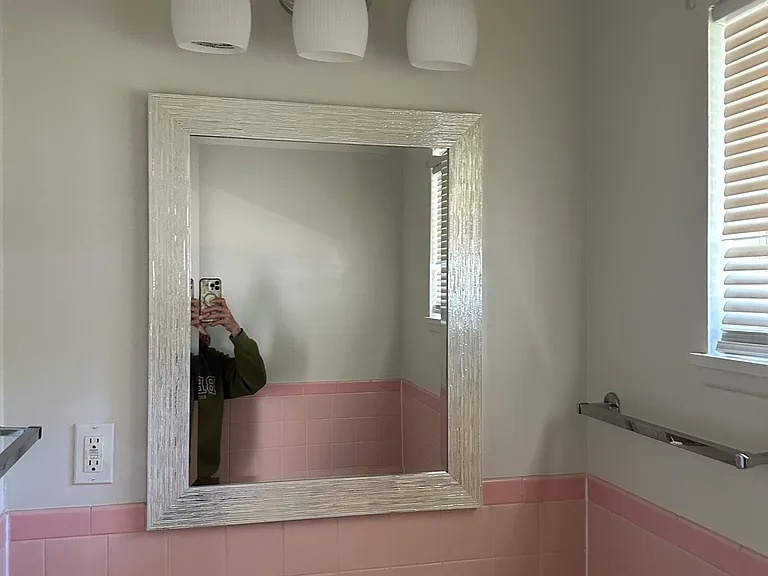 Hall bathroom located off the kitchen.