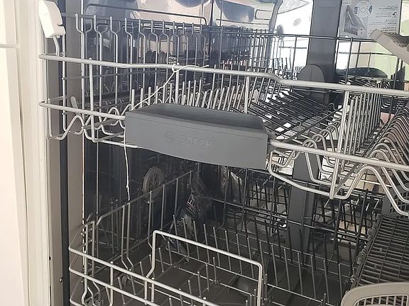 Chromed stainless steel dishwasher tub.