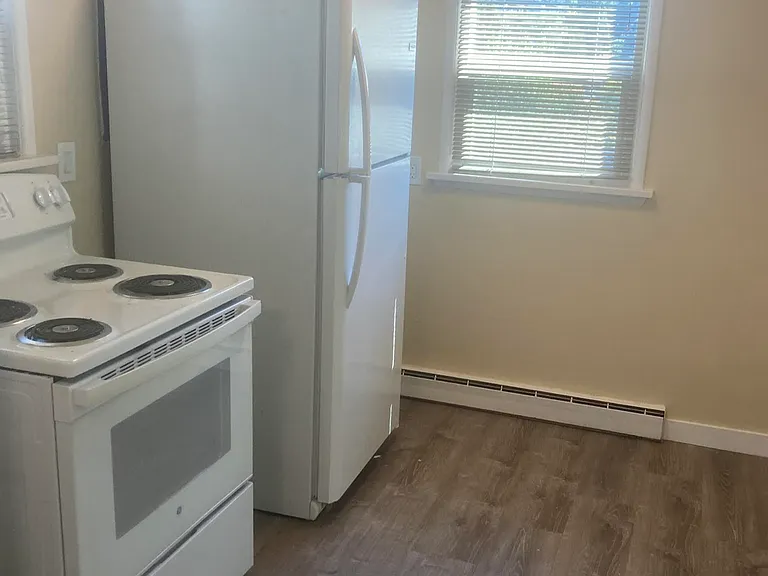 Kitchen appliances. Dine-in area when refrigerator is moved to alternate location in kitchen.