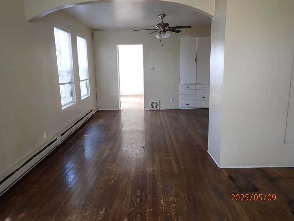 Living room looking to Dining room. Bedroom door is at the end
