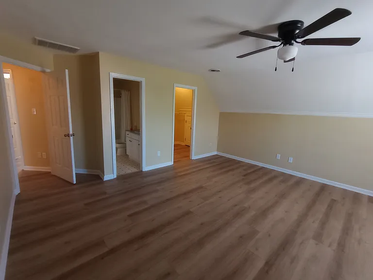 5th(huge)bedroom and further through the right door a 3rd walk in closet. From there, yet further through another door, there is an ample storage space
