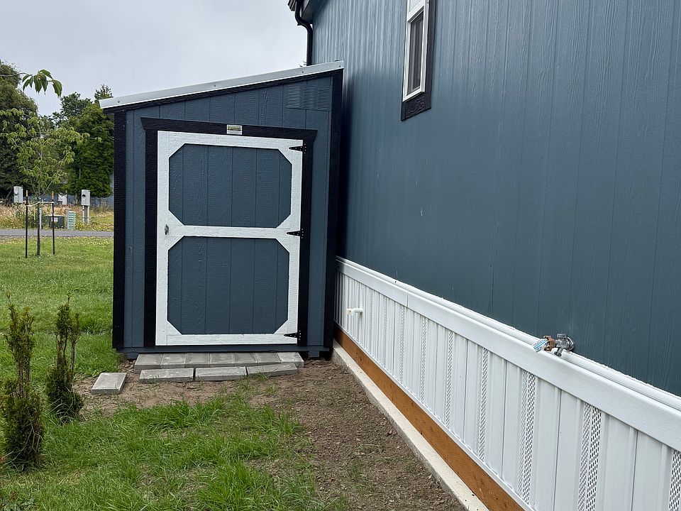 storage shed on side of home