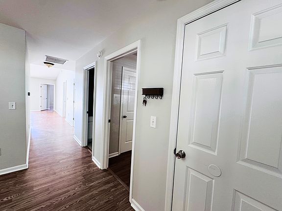 Upon entering, there is a coat closet to the right followed by the front bedroom with private entry to the hallway bath.