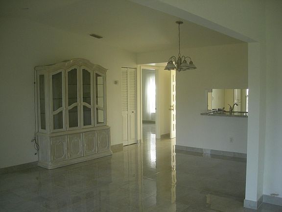 Dining room, kitchen bar and door to the master bedroom.