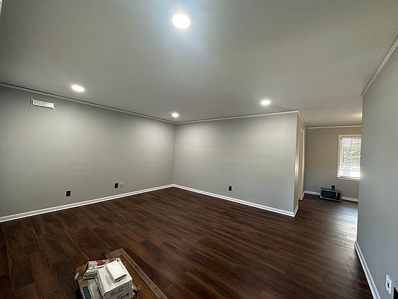 Enter into large living room, 3 big windows along the front provide ample natural light.