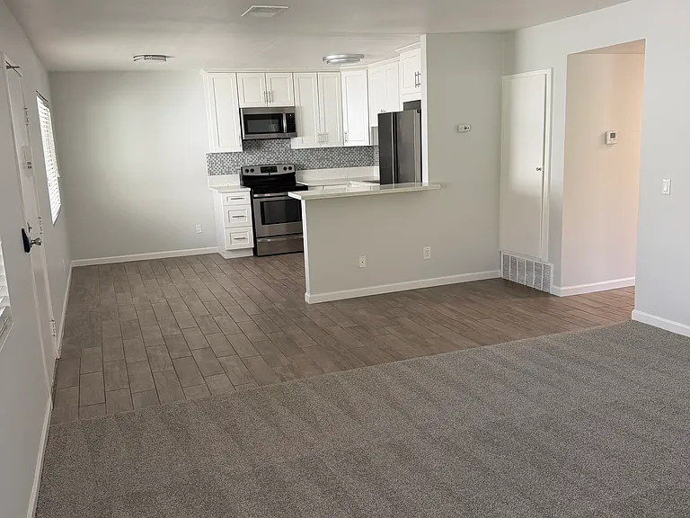 Spacious living room with open kitchen
