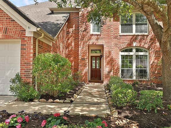 Meticulous landscaping in the front & back make this home truly special. Let's go in a take a look around!
