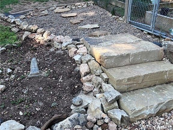 Steps to the fenced garden