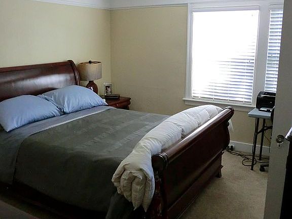 Bedroom; new floors and ceiling fan have not been installed yet.