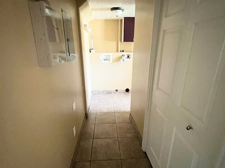 Hallway on level 3 leading to laundry and bathroom