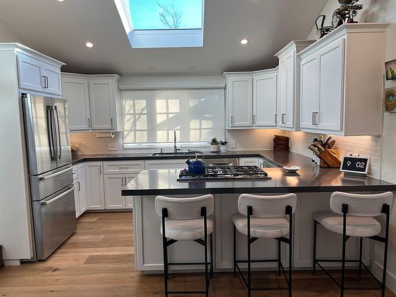 Kitchen with Countertop and Stools