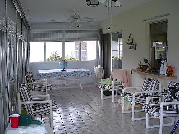 TILED FLORIDA ROOM WITH STORM SHUTTERS