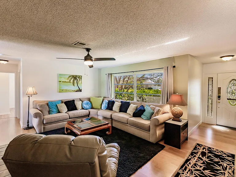 Living room entrance and hallway to two guest rooms and guest full bath room.