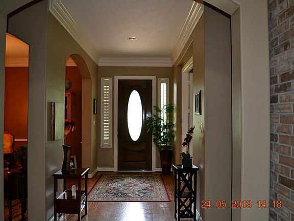 Leaded Glass Front Door. Lots of Crown Molding. Hardwood Floors.