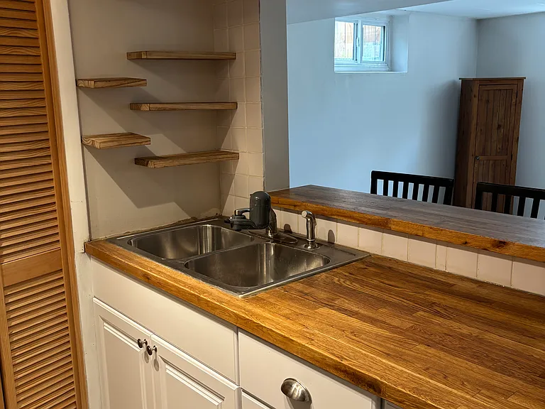 Kitchen with breakfast bar view into dining room