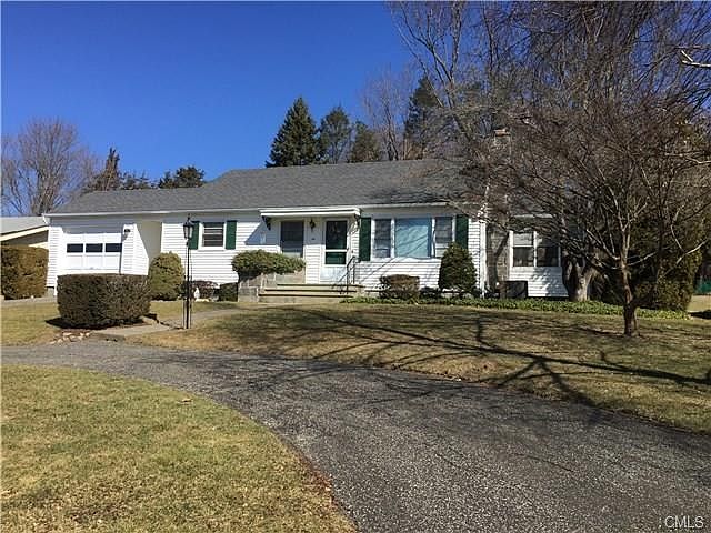 Front view, paved circular driveway