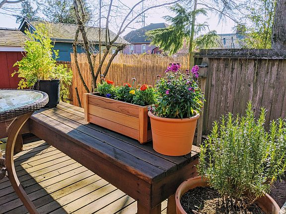 Sun-soaked backyard deck. Perfect for grilling, reading a book, growing some herbs... whatever suits your fancy!