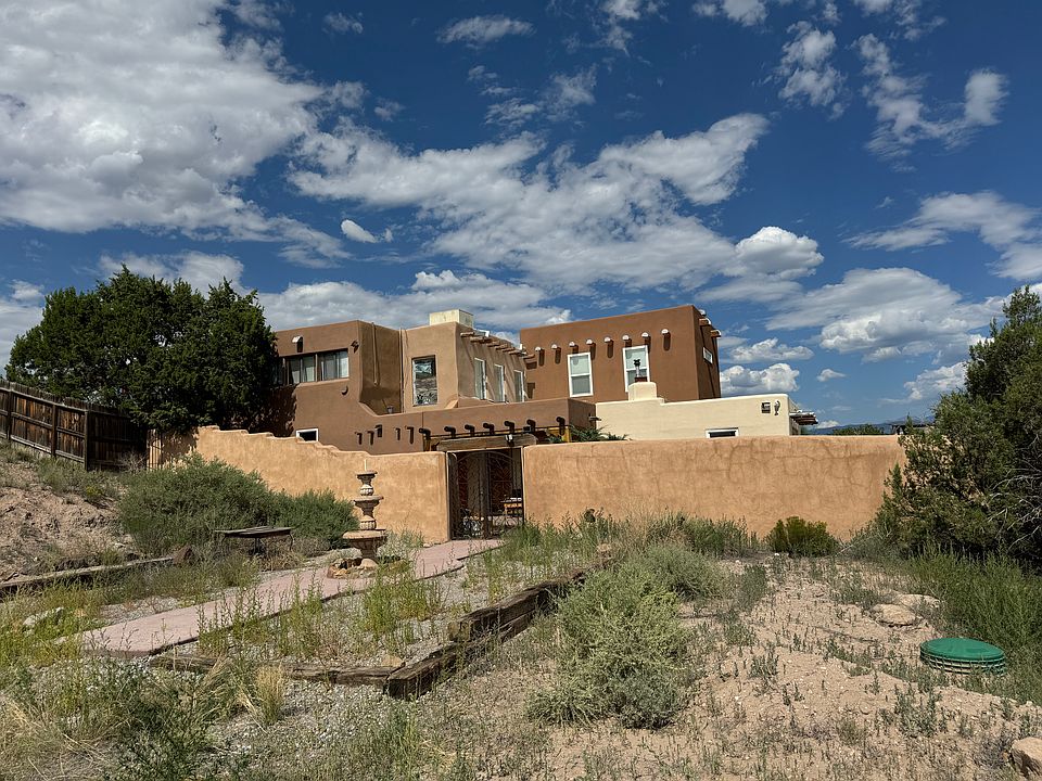 Front of house where you will park off to the side where 2-3 spaces are available