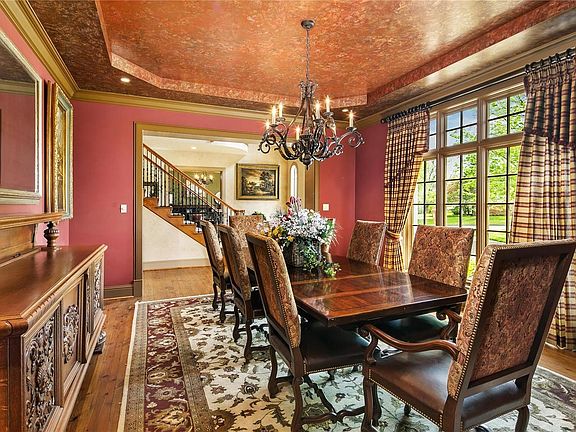 Note the large floor-to-ceiling windows spanning the front wall of the Dining Room.