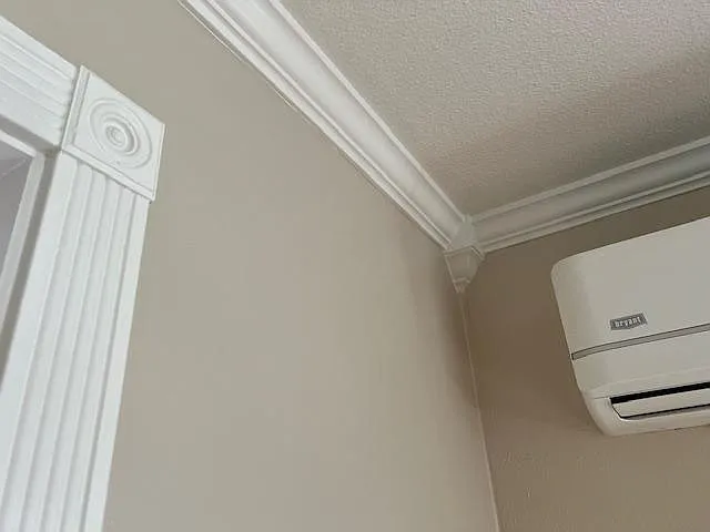 Two paint colors with crown molding and custom trim