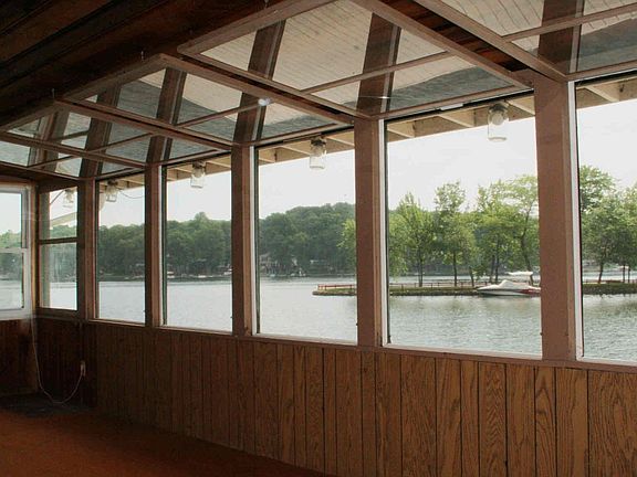 Screened-in porch  Wrap-around views and the lake is just outside the door. 