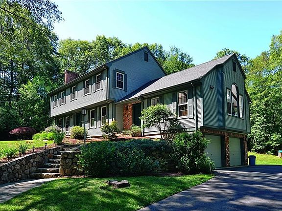Custom built colonial with new roof and newer windows.
